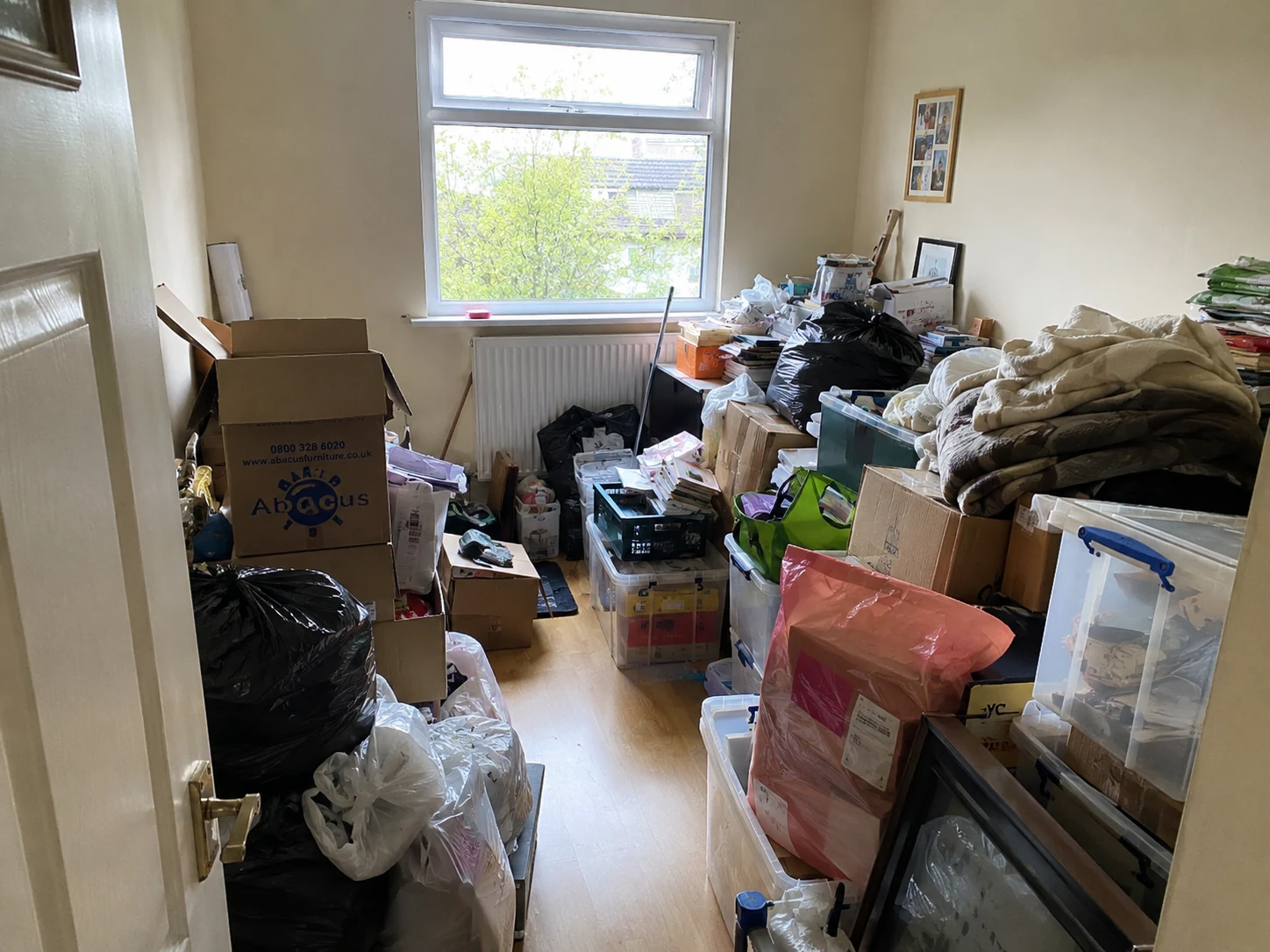 Cluttered room before specialist clearance